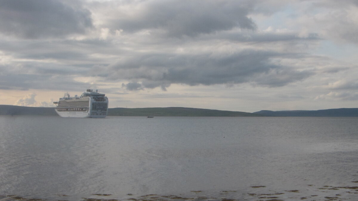 A large cruise ship in a calm sea