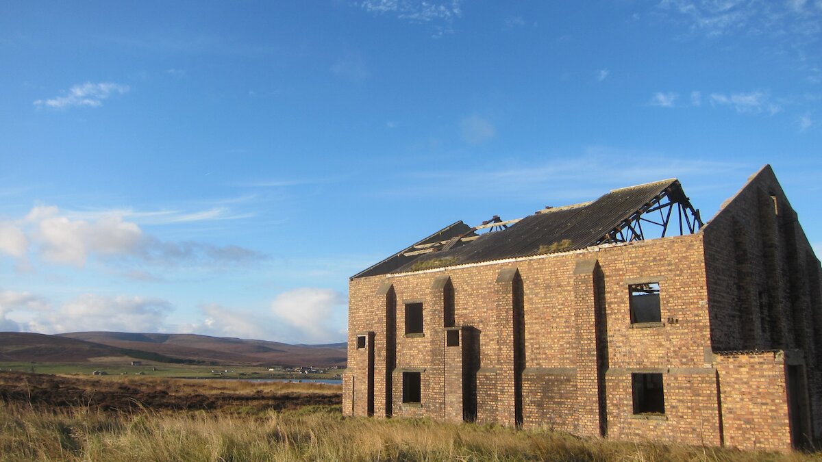 A ruined military building in a field